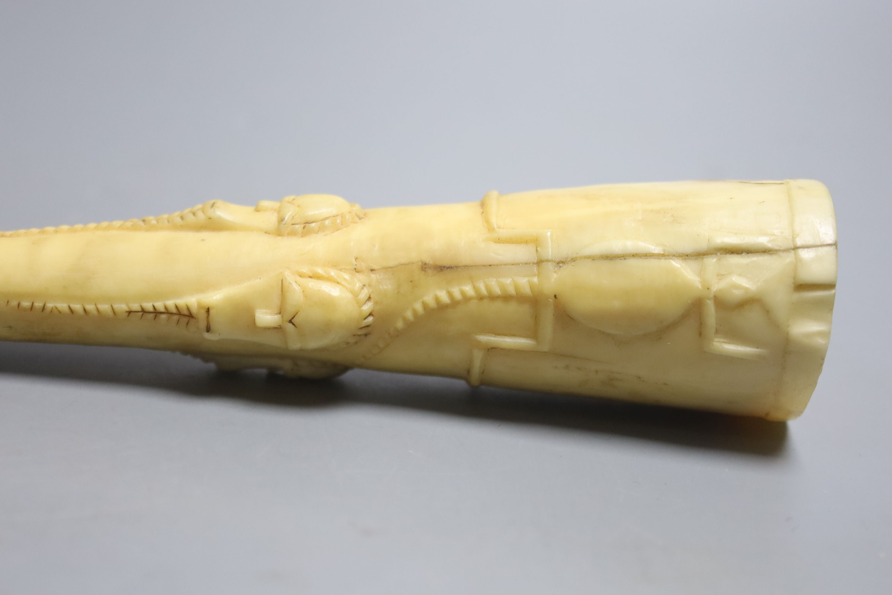 A 19th century West African tusk cup, length 22cm